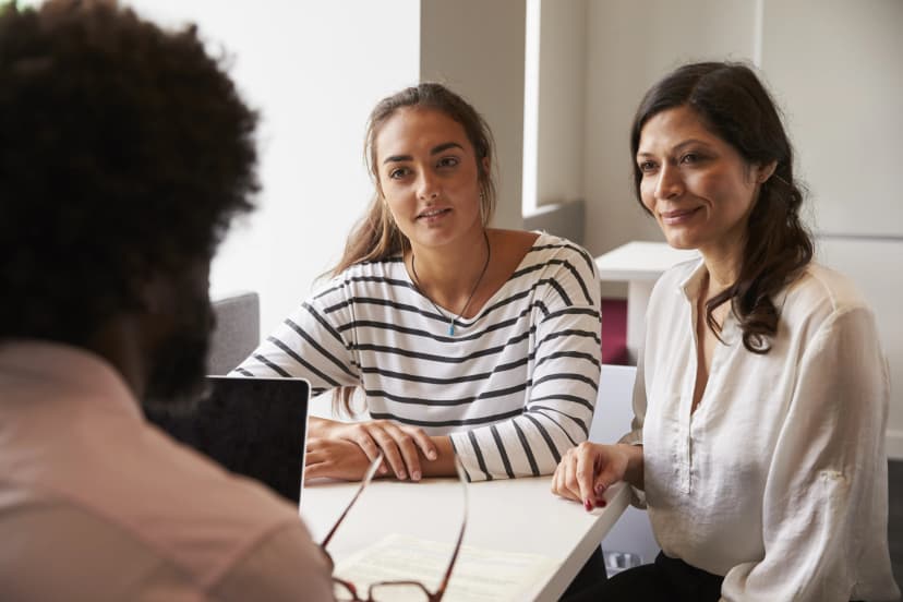 Student and parent in meeting with instructor